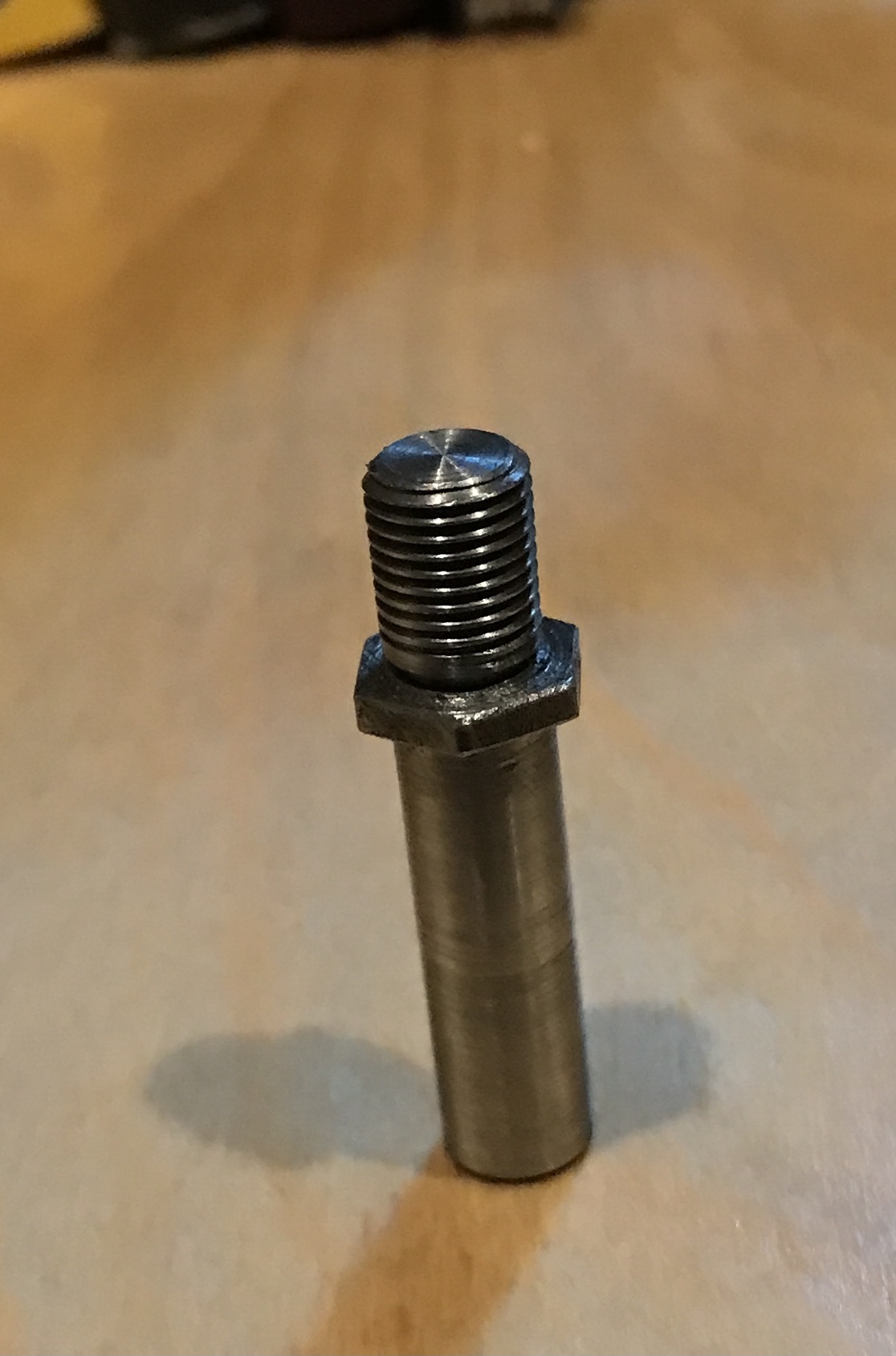 The incorrectly threaded new stud